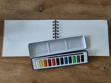 Watercolour paints and pad.