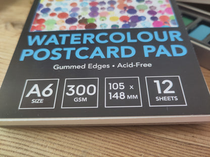 Watercolour paints and postcard watercolour pad